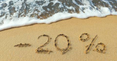 20 procent korting geschreven op het strand